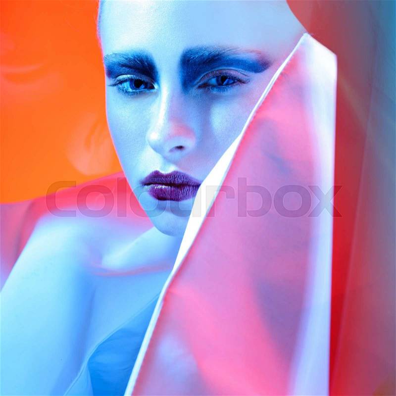 Close up portrait of art color woman face.White face.Mime make up.Full ldark lips.Studio shot.Yellow background, stock photo