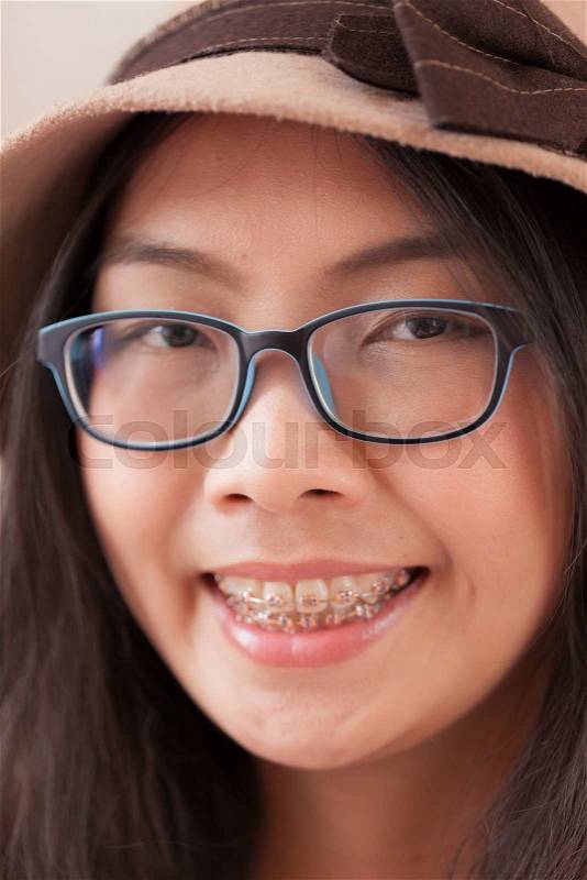 Clouse up face asia woman.joy and smile woman wear hat and eyeglasses, stock photo