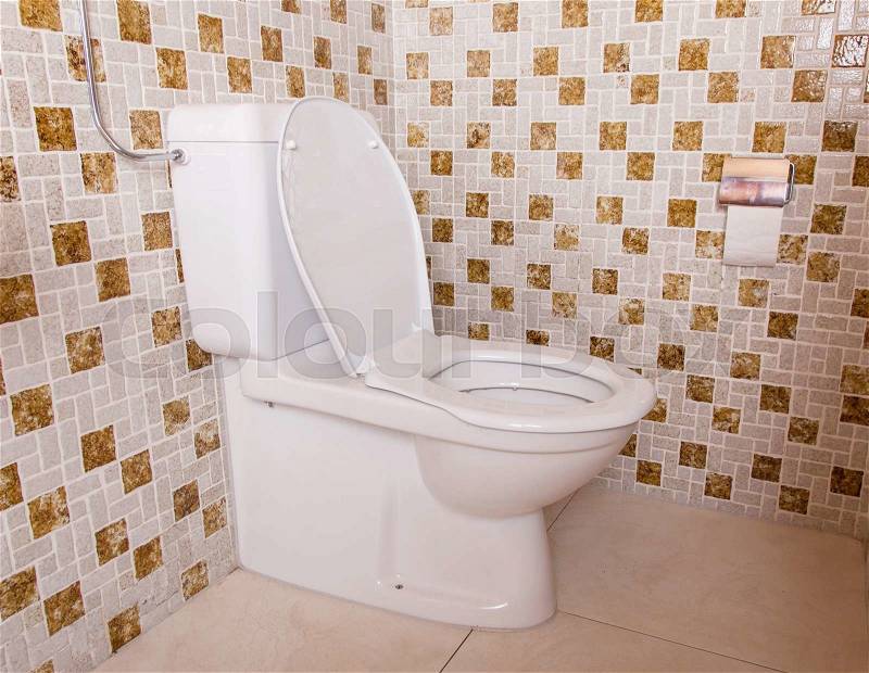 Old clean toilet with old tiles (80s), stock photo
