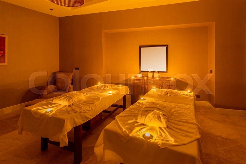 Spa room with burning candles, stock photo