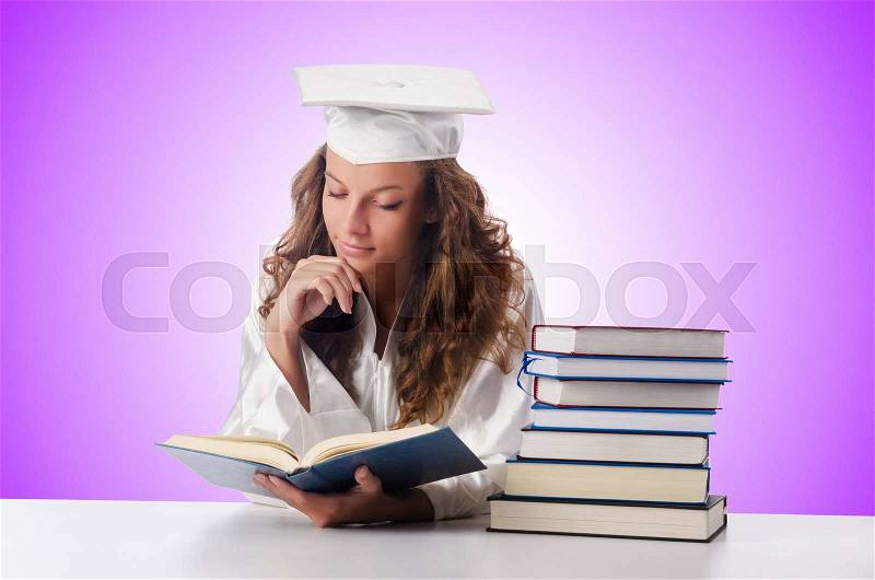 Happy graduate with lots of books on white, stock photo