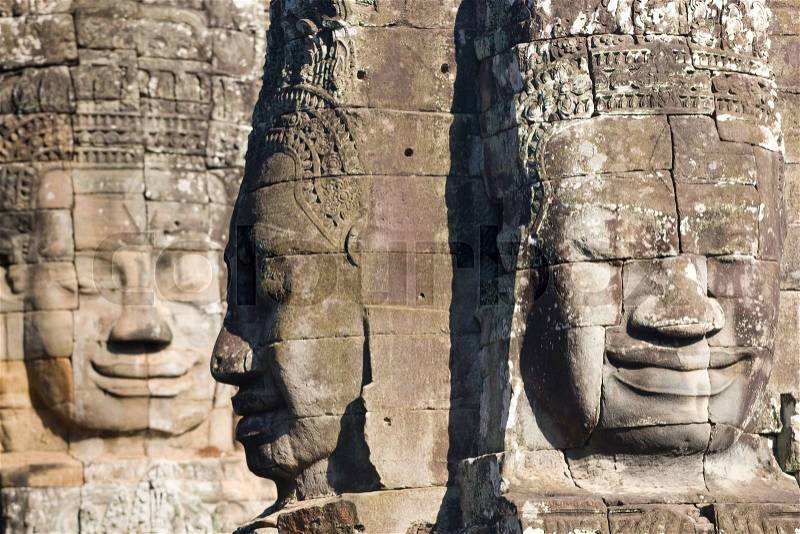 Smiling faces in the Temple of Bayon,Bayon is most famous place, built in the 13th century as the centre of Angkor Thom, stock photo