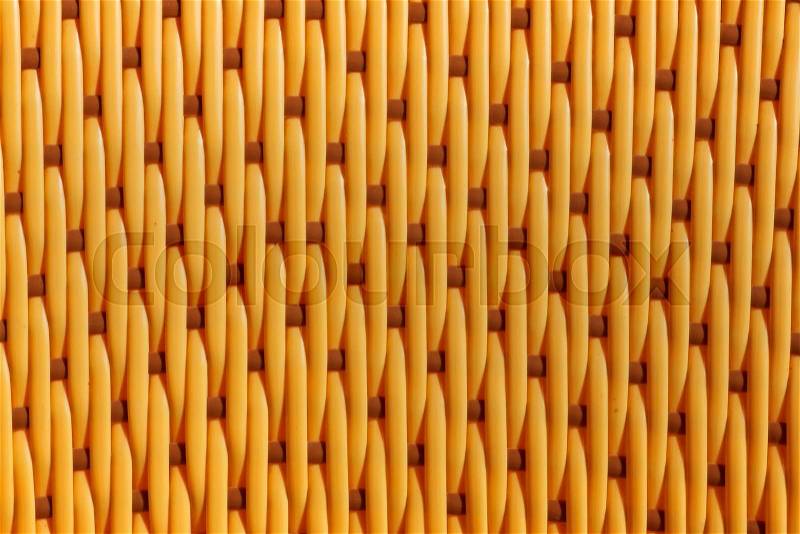Close up of yellow weaved plastic texture, stock photo