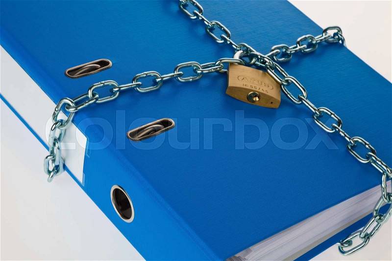 A file folder with chain and padlock closed. privacy and data security, stock photo