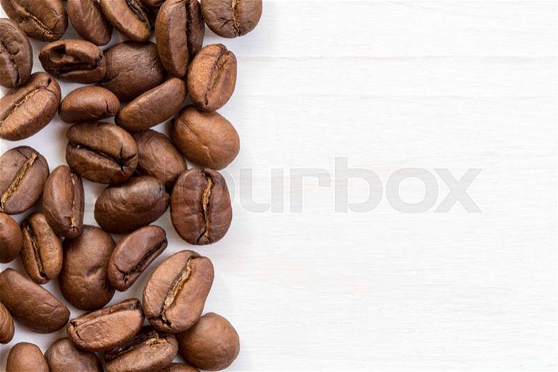 Coffee bean border on painted wood surface , stock photo