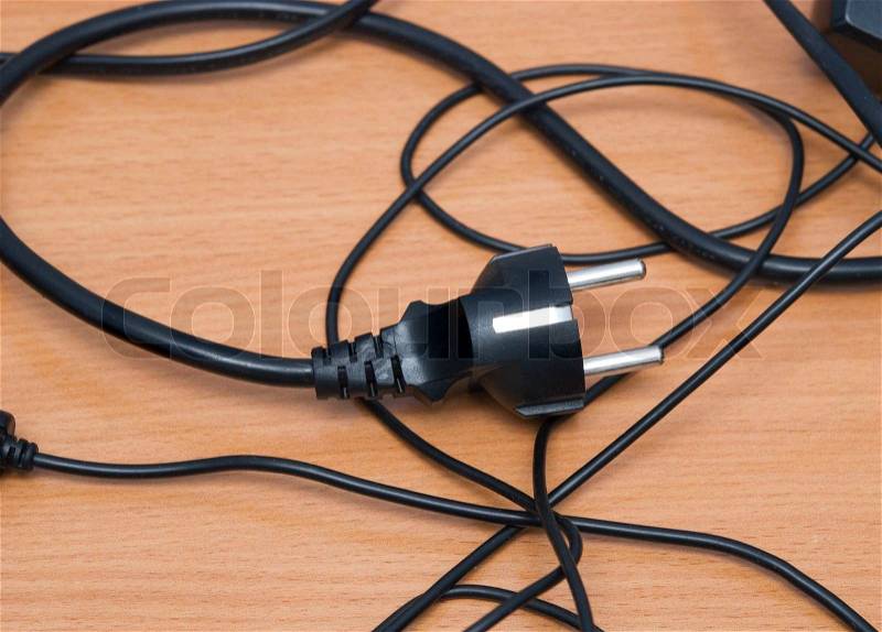 Electrical plug on a table, stock photo