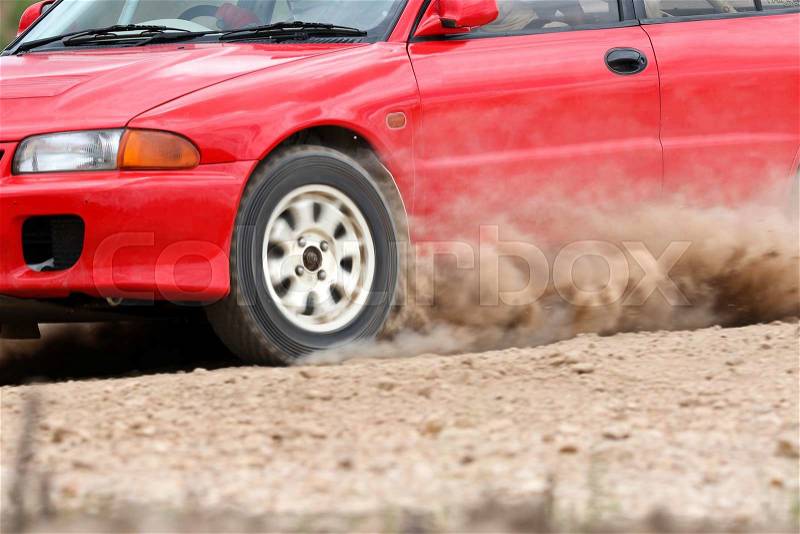 Rally car in dirt track, stock photo