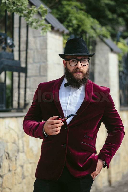 Rich man with a beard, thinking about business, stock photo