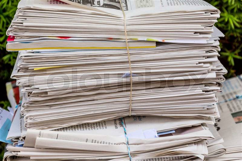 A stack of old newspapers ready for removal by waste paper disposal, stock photo