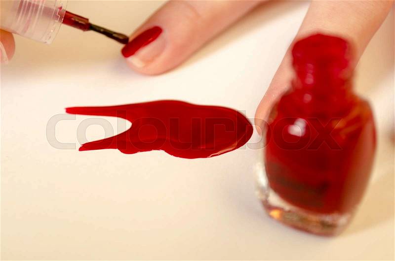 In beauty salon.Toes with red nail polish, stock photo