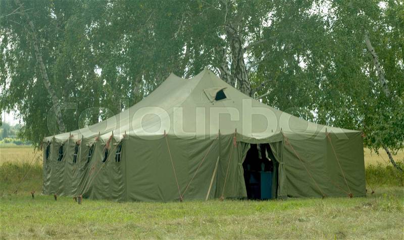 Big old army expedition tent the forest, stock photo