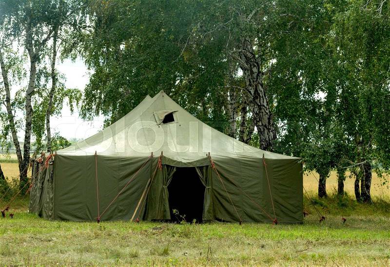 Big old army expedition tent the forest, stock photo