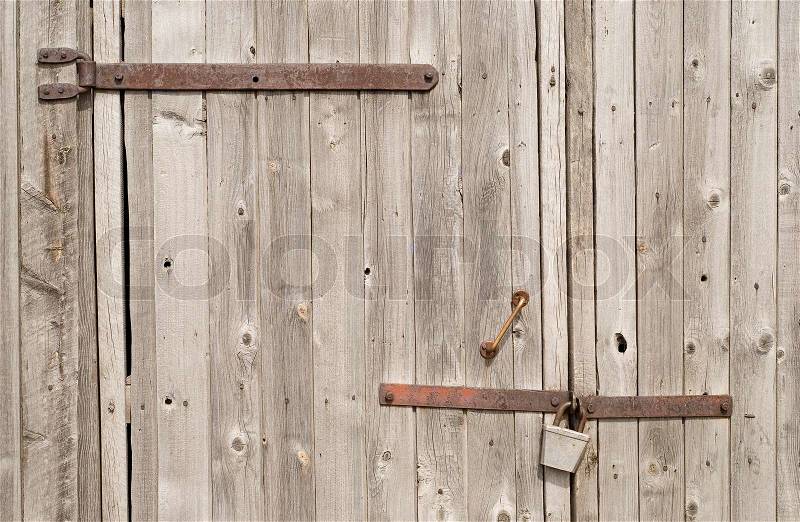 Close-up view of wooden gate and lock, stock photo