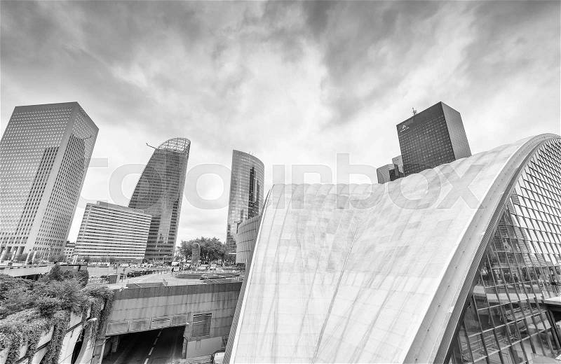 PARIS - JUNE 9, 2014: Black and white view of La Defense modern buildings. La Defense is the business district of Paris, stock photo