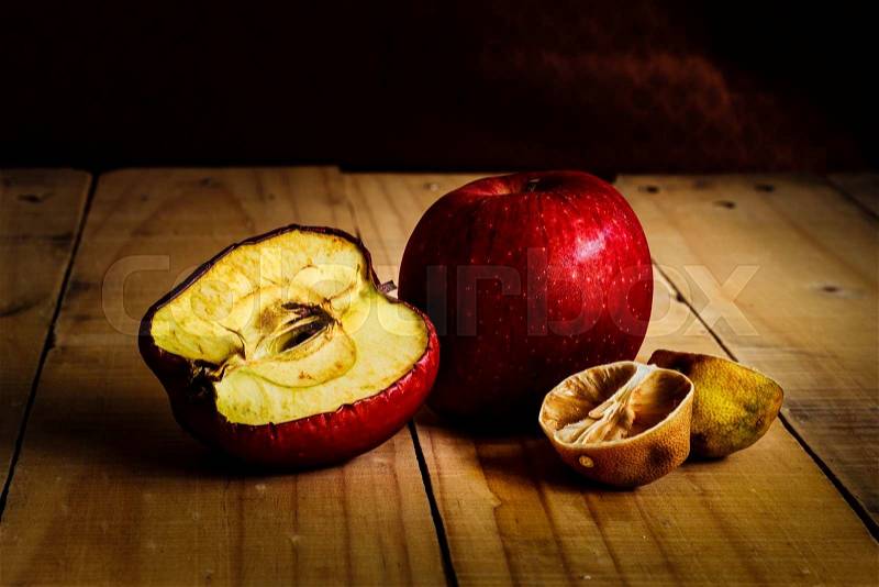 Rot and withered Fruits,On wooden plate, stock photo