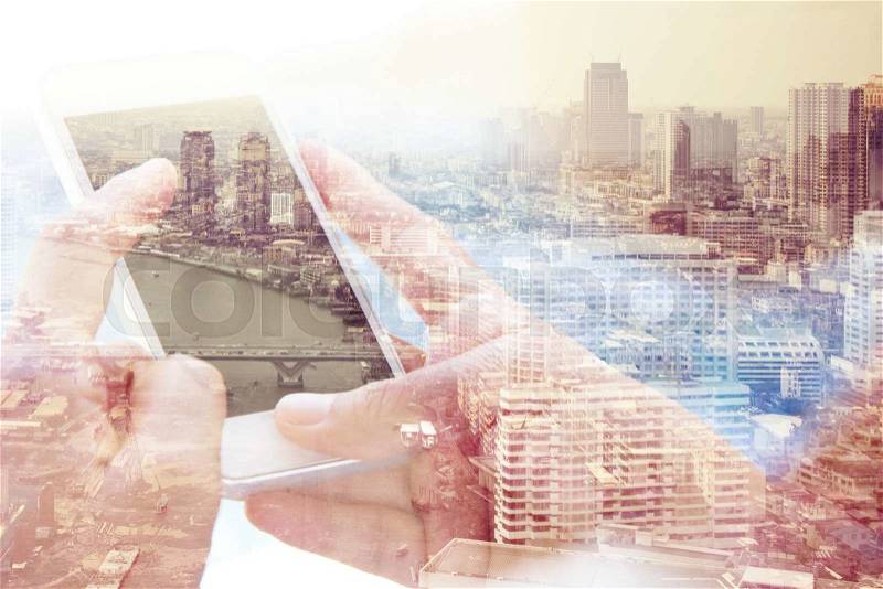 Using smart phone double exposure. Business technology concept, stock photo