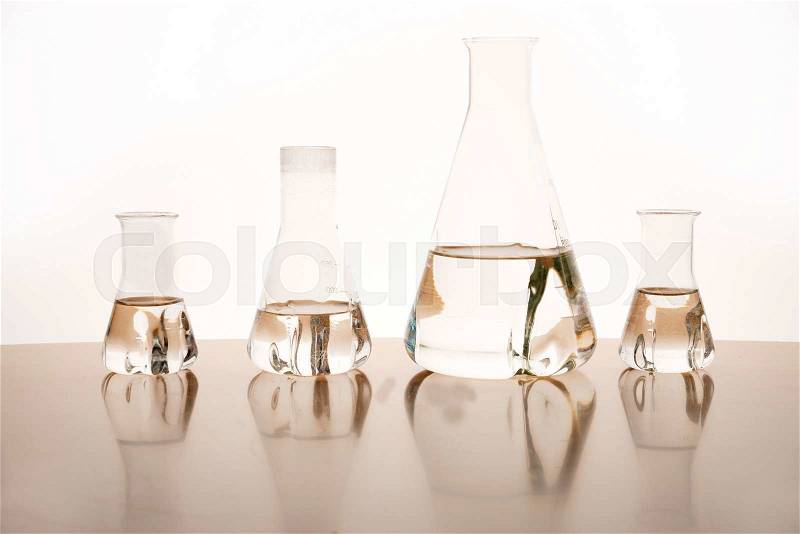 Measuring glasses on a table of a chemical laboratory, stock photo