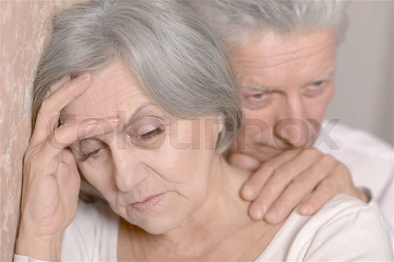Portrait of a sad elderly couple together, stock photo