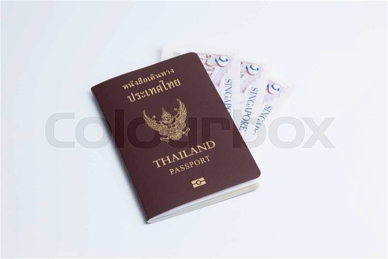 Thai passport with singapore currency. Singapore banknote, stock photo
