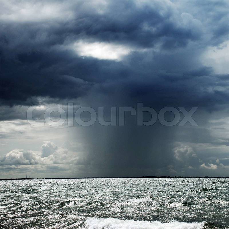 A storm cloud over the ocean, stock photo