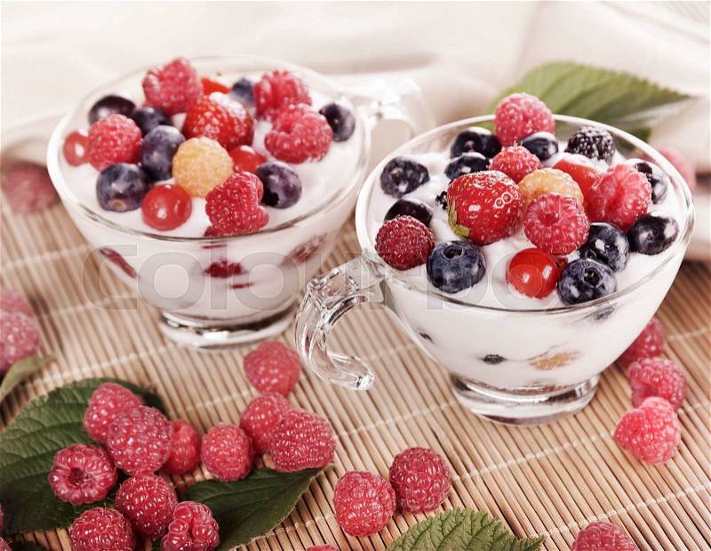 Two Cups Of Yogurt With Berries, stock photo