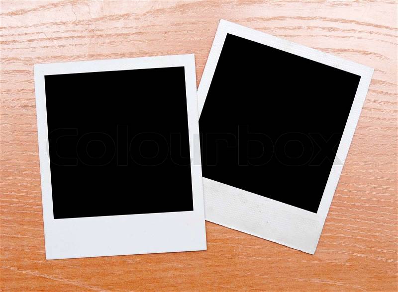 Polaroids on a wooden background, stock photo