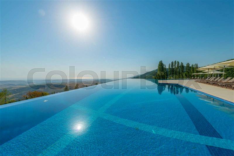 Infinity pool on the bright summer day, stock photo