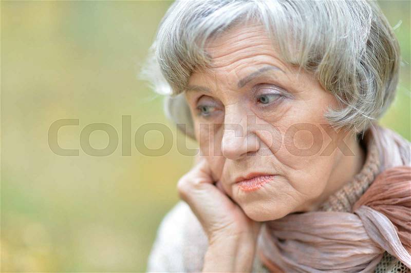 Portrait of a thoughtful sad elderly woman close-up, stock photo