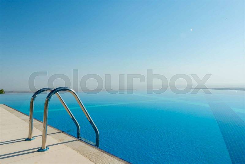 Infinity pool on the bright summer day, stock photo