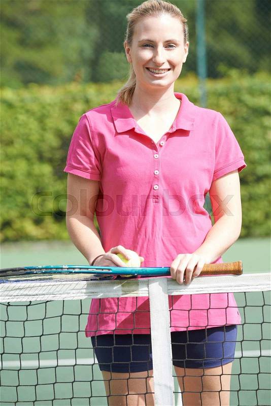 Portrait Of Female Tennis Coach On Court, stock photo