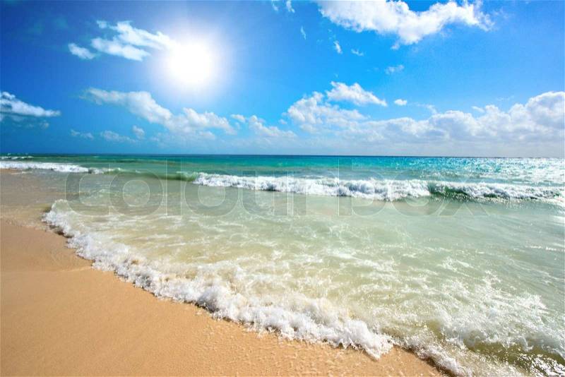 Beautiful beach and waves of Caribbean Sea, stock photo