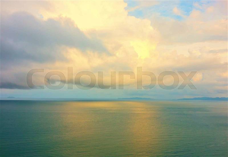 Rainy cloudy sky over sea, stock photo
