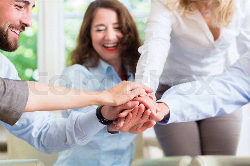 Business Team getting motivation for better work stacking hands, stock photo
