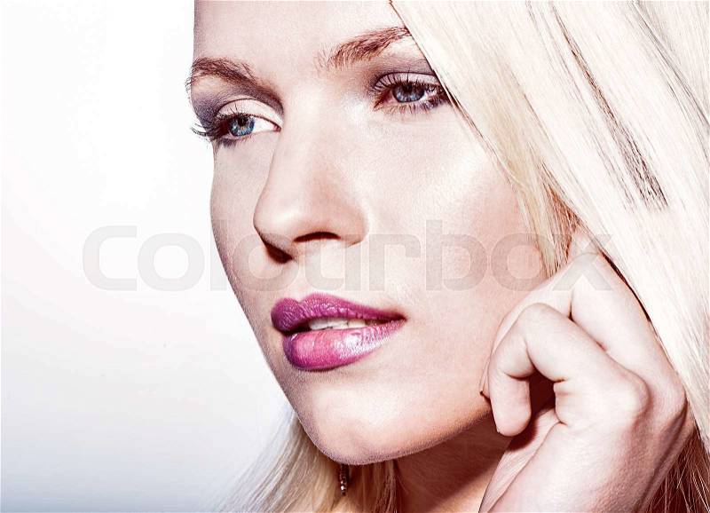 Portrait of beautiful blond woman with natural makeup posing on studio background.Perfect clean skin, stock photo