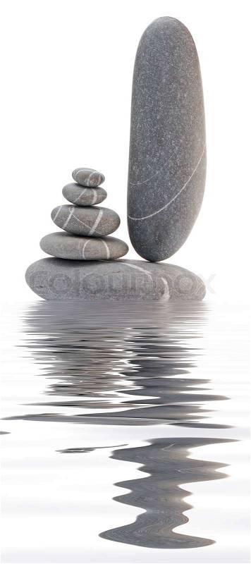 Pebble tower reflected in water, stock photo