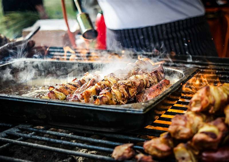 Cooking meat barbecue on fire, stock photo
