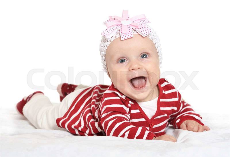 Adorable baby girl in cute clothes on a white background, stock photo