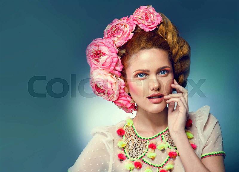 Close up portrait of art color woman face in white bright blouse wearing pink flower wreath on head.Stylish hairstyle.Fashion look.Perfect clean skin.Full pink lips, stock photo