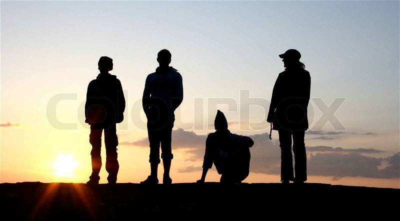 Silhouette of a Group of People on sunset, stock photo