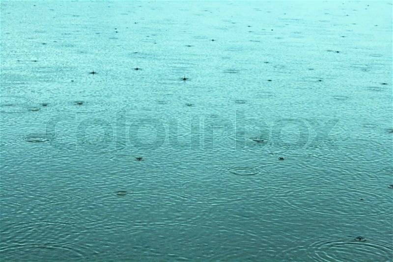 Impact of a fresh water drop on a rainy day, stock photo