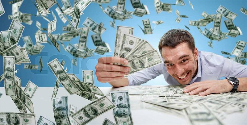 Business, people, success and fortune concept - happy businessman with heap of dollar money over blue background, stock photo