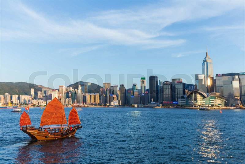 Hong Kong victoria habour with red ship and building in background, stock photo