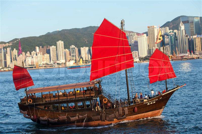 Hong Kong victoria habour with red ship and building in background, stock photo