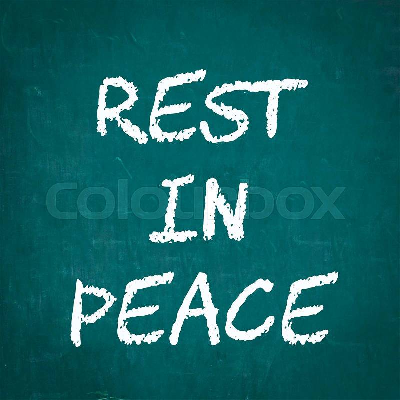 REST IN PEACE written on chalkboard, stock photo