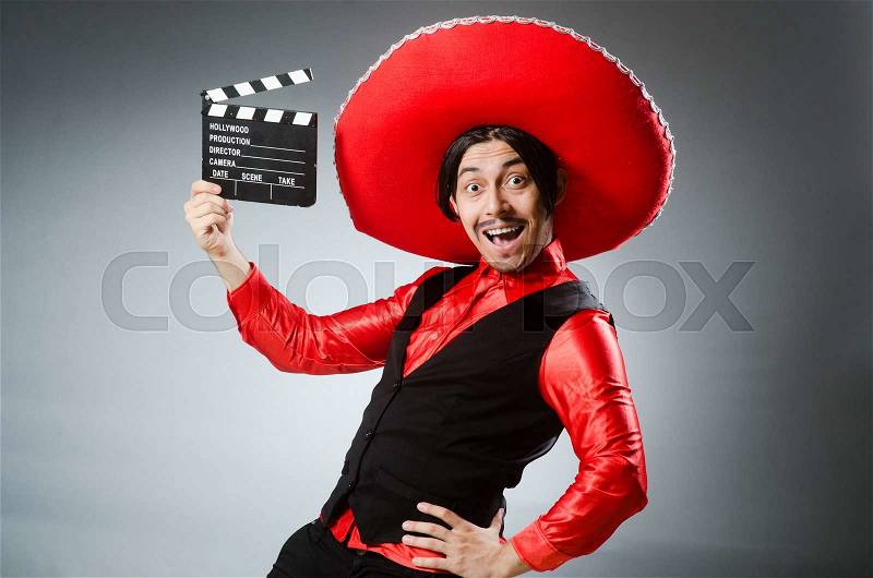 Mexican with movie board in funny concept, stock photo