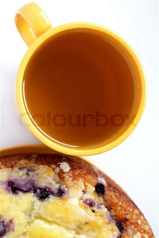 Blueberry cake and a cup of green tea, view from above, stock photo