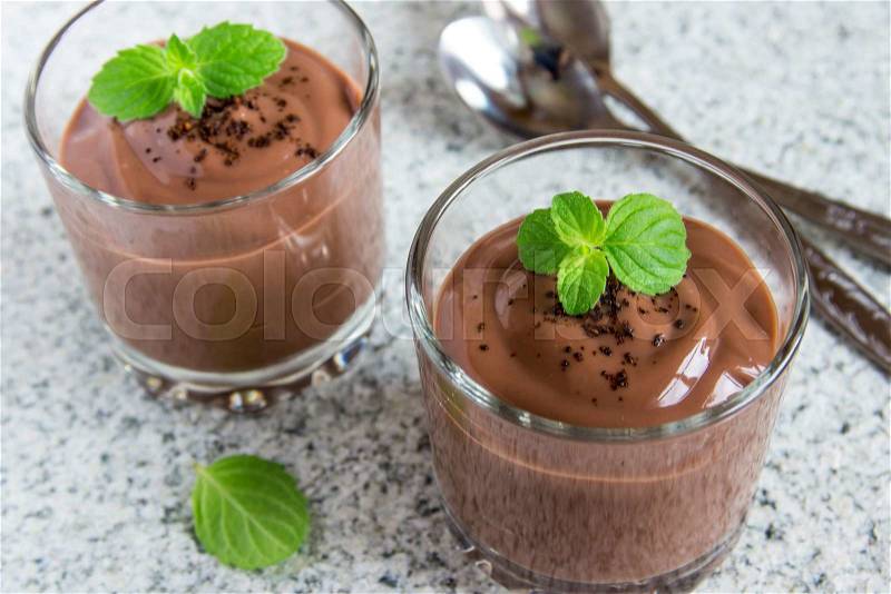 Chocolate mousse with mint in portion glasses, stock photo