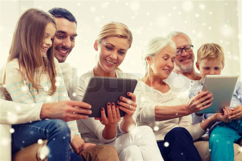 Family, generation, technology and people concept - smiling family with tablet pc computers at home, stock photo