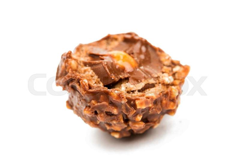 Chocolate truffle with nuts on a white background, stock photo