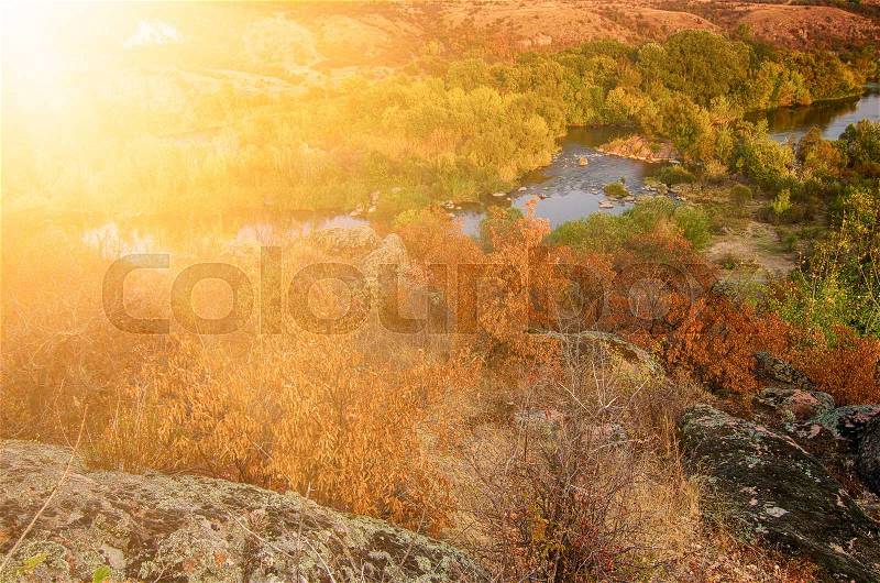 Rural autumn sunset sunny soft landscape with river and colorful trees, seasonal background, stock photo